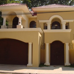 Two-story facade with arcades and balconies, Hugo Coello Architects